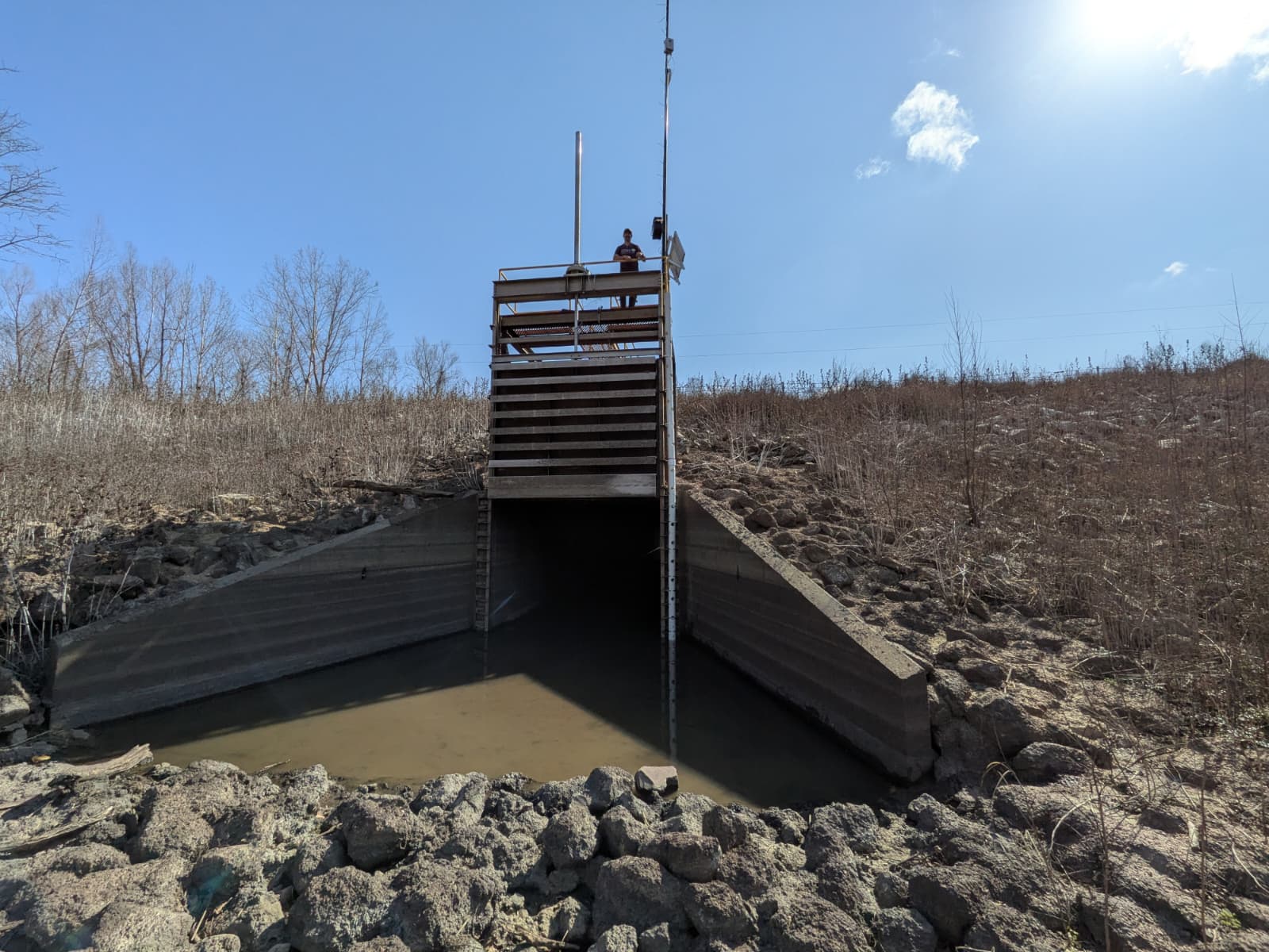 The Loch Leven water control gate — concrete channel and wooden platform through which the Mississippi River enters the floodplain